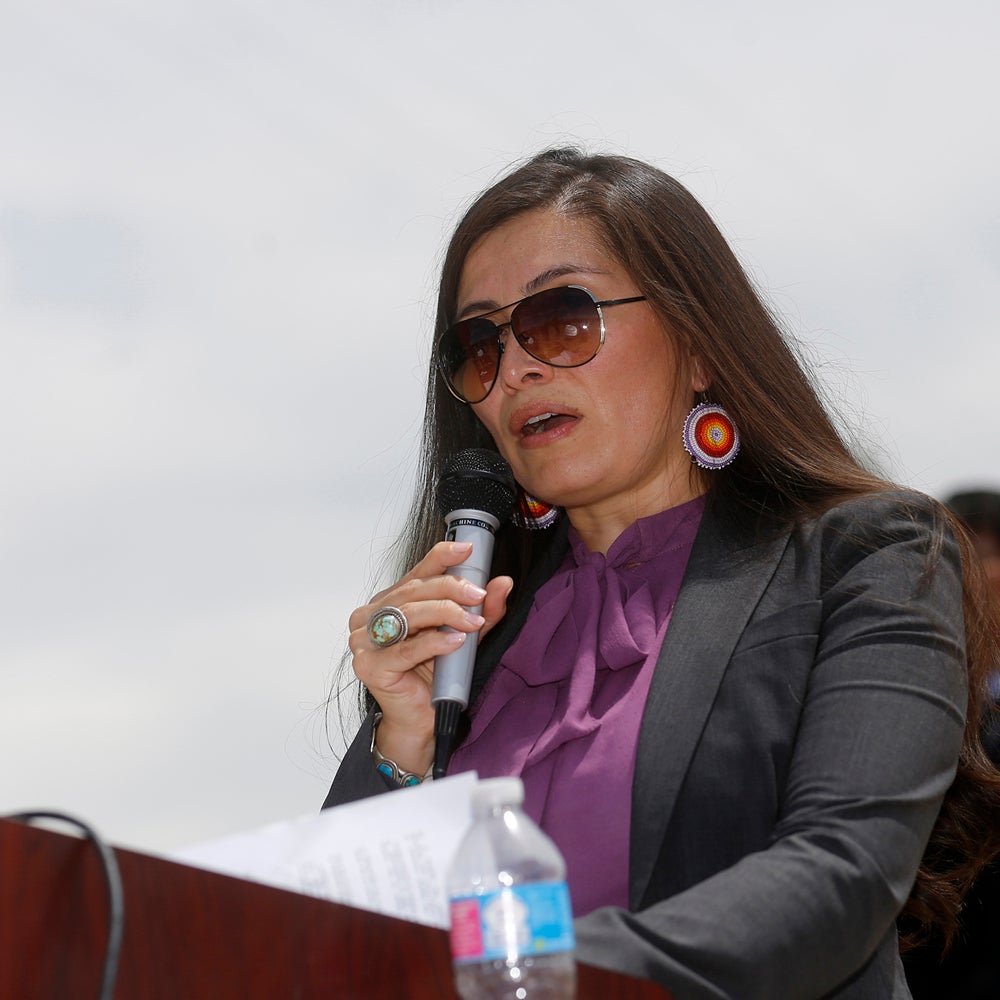 Navajo Nation Attorney General Ethel Branch speaks Tuesday, Aug. 16, 2016, at Nizhoni Park in Shiprock, N.M. Leaders of the Navajo Nation, one of the nation's largest American Indian tribes, blasted the U.S. Environmental Protection Agency as their attorneys sued Tuesday, claiming negligence in the cleanup of a massive mine waste spill that tainted rivers in three Western states. (Jon Austria/The Daily Times via AP)