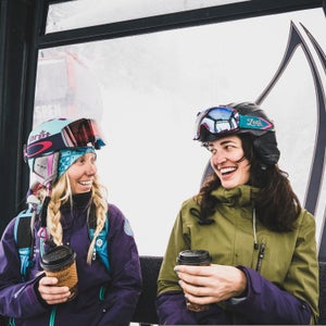 Sammy Podhurst and Janelle Huelsman fuel up on the gondola before a day of powder skiing on Aspen Mountain, Colorado.