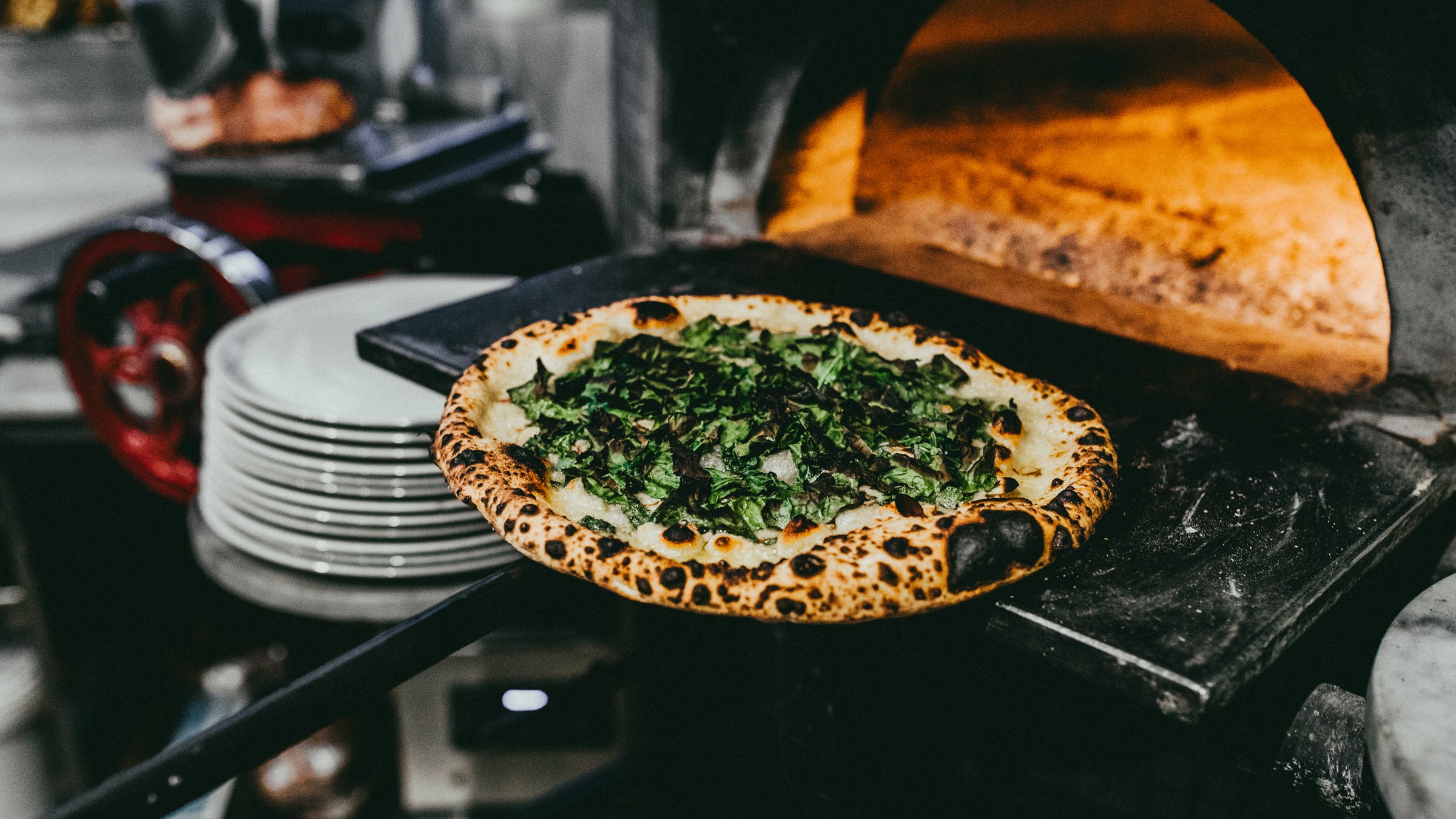 Krar says Pizzicletta's SS-145 pizza combination of Gorgonzola, charred kale, and lemon juice atop a perfectly charred crust is a masterpiece.