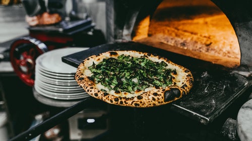 Krar says Pizzicletta's SS-145 pizza combination of Gorgonzola, charred kale, and lemon juice atop a perfectly charred crust is a masterpiece.