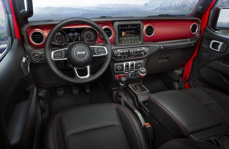 The new interior is modern and refined, with an available leather-wrapped dash and 8-inch infotainment screen. The red dash panels are made from aluminum and available in other colors if they’re too loud for you and are replaceable.