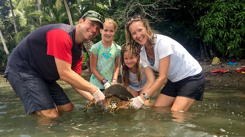 A family working with sea turtles in Osa Peninsula, Costa Rica with Give A Day Global.