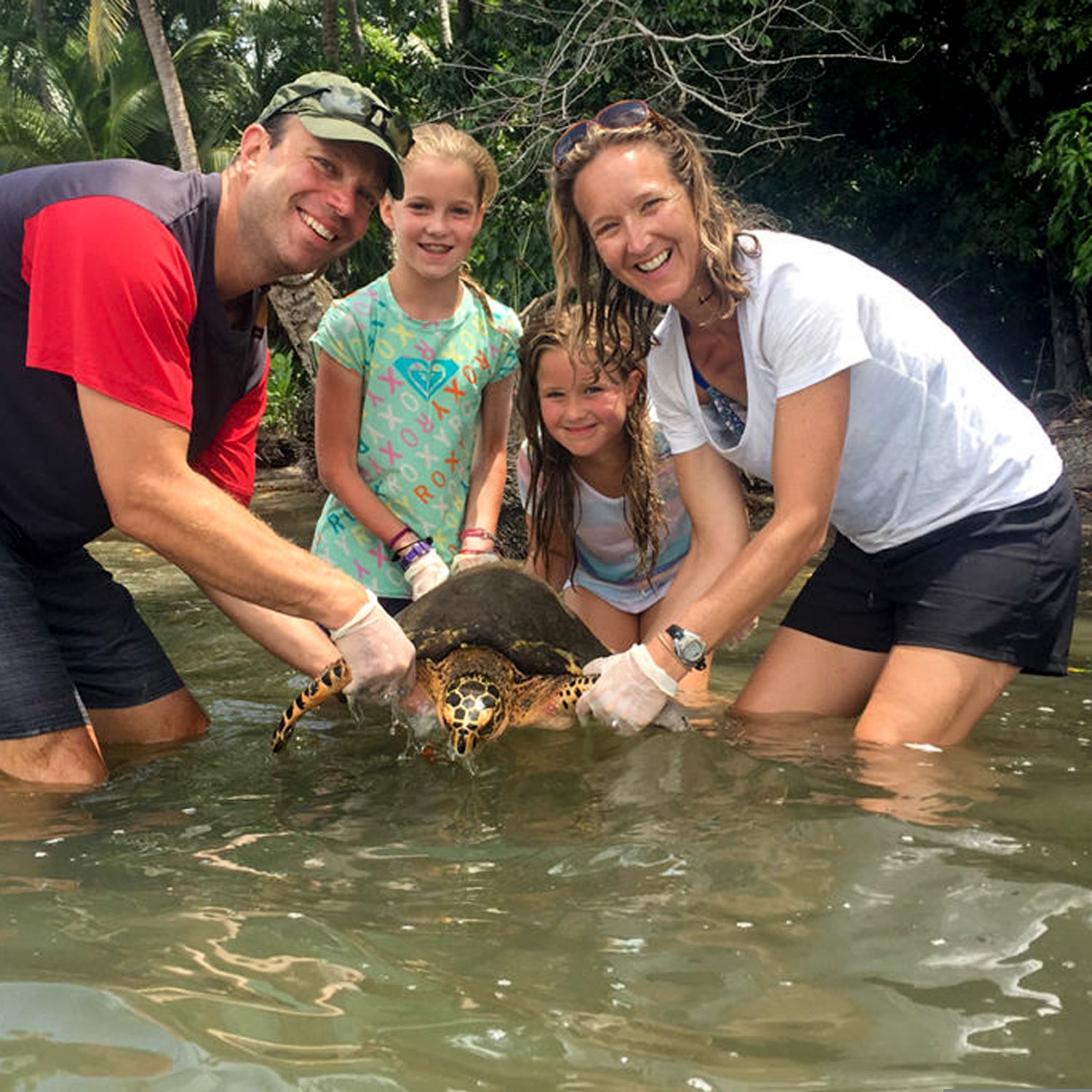 A family working with sea turtles in Osa Peninsula, Costa Rica with Give A Day Global.