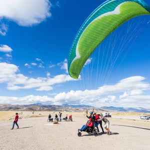 Thomas and Chris Santacroce prepare for a tandem flight in Draper, Utah