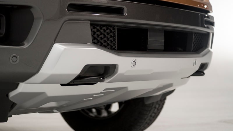 On other trucks, the factory skid plates are made from thin aluminum, and are sometimes even bolted to fragile components rather than the actual frame. Not so on the Ranger. What you're looking at is made from sturdy steel, and mounted to the frame. The same is true for the other two skids, which protect the engine's sump, and the transmission.