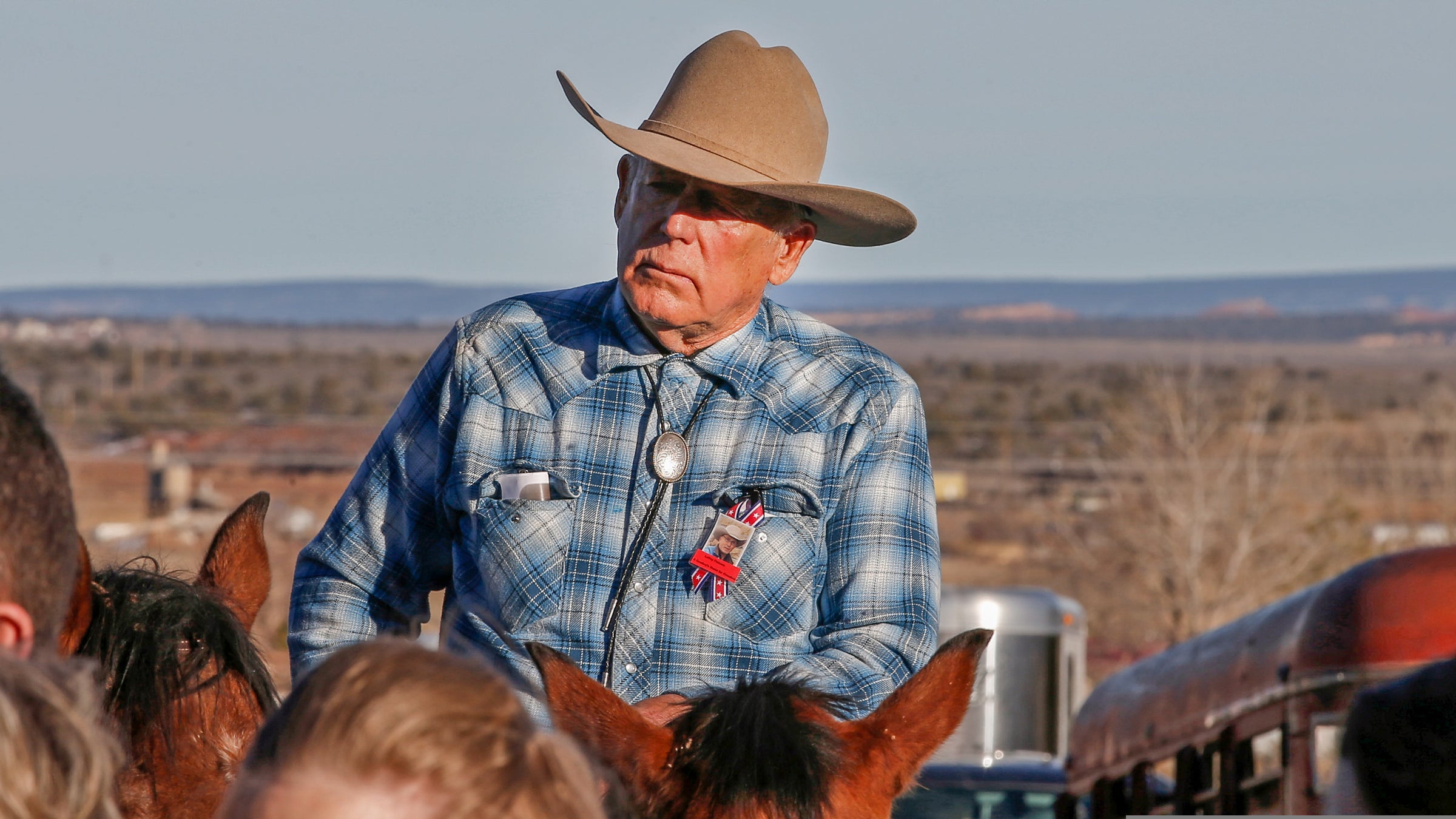 Cliven Bundy rides a horse after attending the funeral of fellow rancher Robert "LaVoy" Finicum.