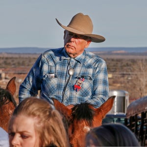 Cliven Bundy rides a horse after attending the funeral of fellow rancher Robert 