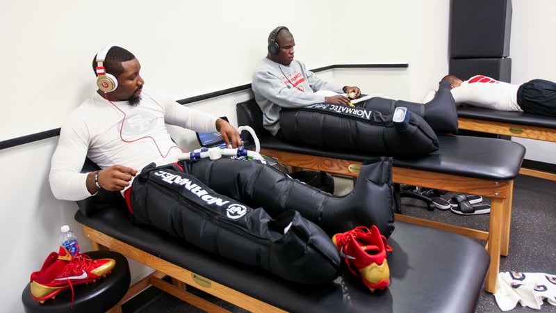 NaVorro Bowman and Frank Gore of the San Francisco 49ers refresh their legs with a Normatec treatment in the locker room prior to Super Bowl XLVII  February 2013.