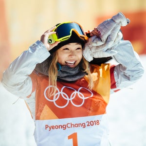Chloe Kim reacts to her first run score of 93.75—enough to secure gold. Kim's victory lap, however, improved her score to a near-perfect 98.25.
