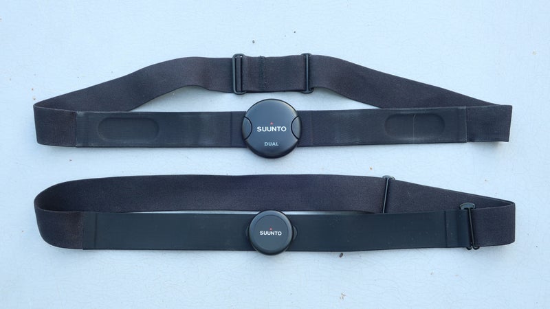 The Dual Comfort Belt (top) versus the new Smart Sensor Belt (bottom). Notice that the Smart Sensor has a smaller receiver, relocated girth adjuster (back right), and different closure system (front right).