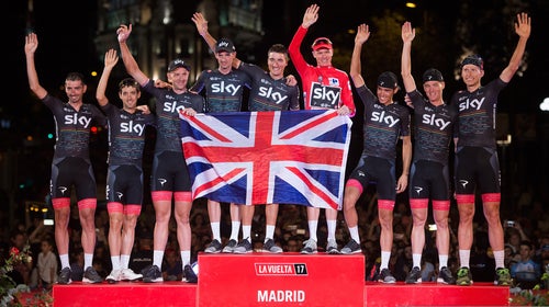 Britain's Chris Froome of Team Sky celebrates with teammates on the podium after winning the Vuelta a Espaa.