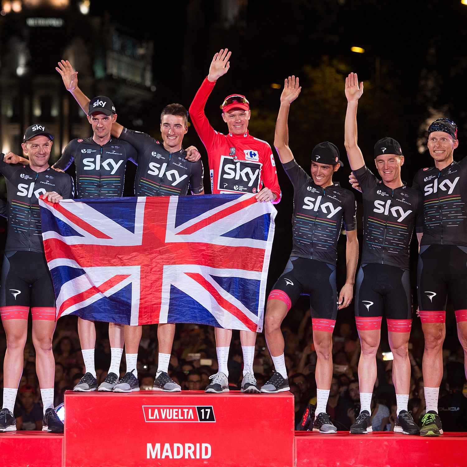 Britain's Chris Froome of Team Sky celebrates with teammates on the podium after winning the Vuelta a Espaa.