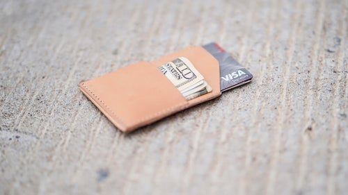 Fat wallets be gone! Thanks to just two pockets, this tiny, handmade leather pouch will only carry a couple cards and some cash, forcing you to pair down and simplify your life. It might not be for everyone, but for looking to clear out wallet clutter, it鈥檚 a God-send.