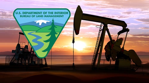 ID-sized badges to be worn by BLM employees prominently feature an oil derrick.