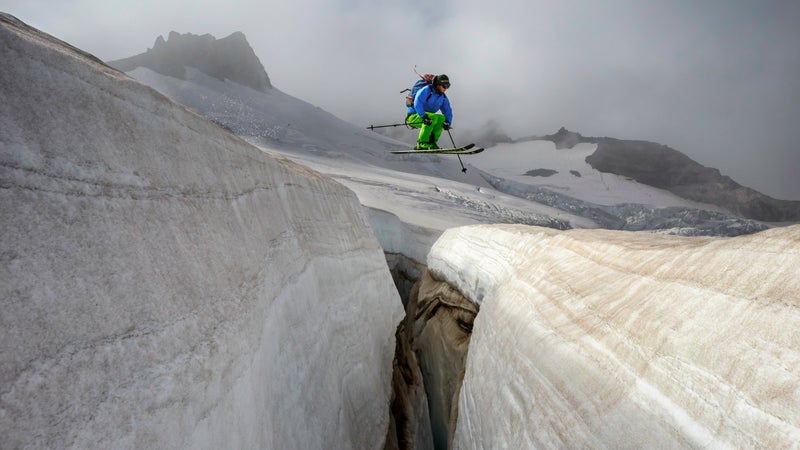 Roberts jumping across a crevasse on the Paradise Glacier. Mount Rainier National Park, Washington