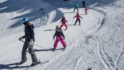 Snow King ski instructor Ramona Davis works on turns with a young group of Coombs Foundation skiers.