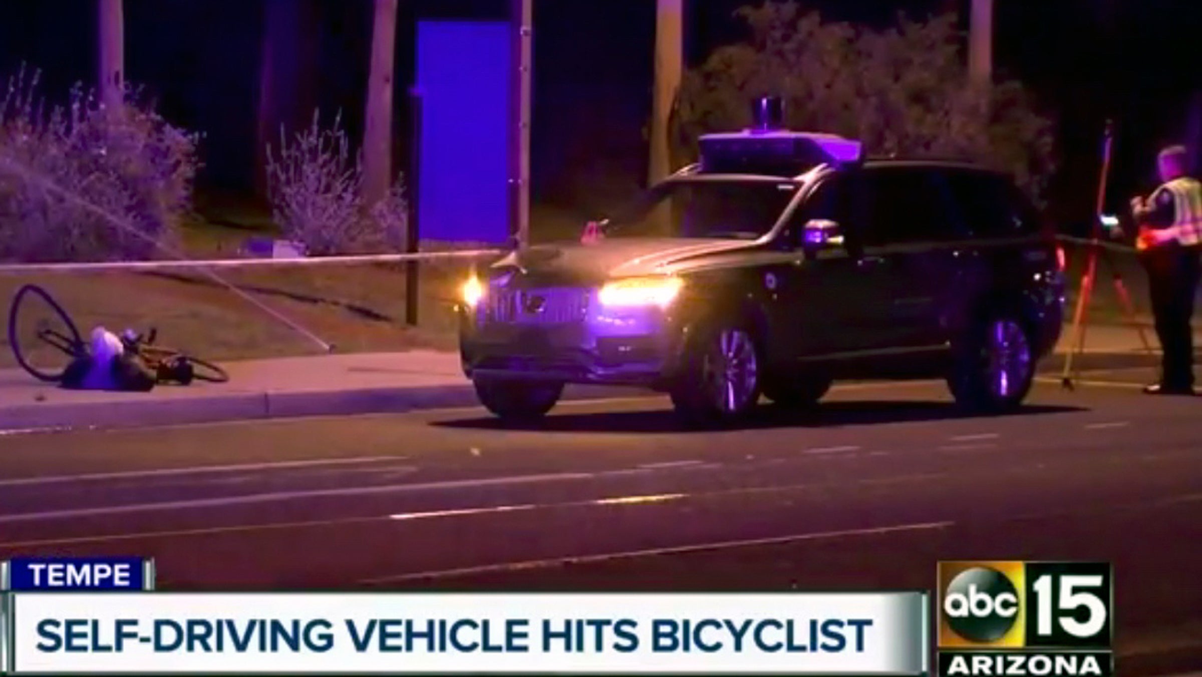 This March 19, 2018 still image taken from video provided by ABC-15, shows investigators at the scene of a fatal accident involving a self driving Uber car on the street in Tempe, Ariz. Police in the city of Tempe said that the vehicle was in autonomous mode with an operator behind the wheel when the woman walking outside of a crosswalk was hit.