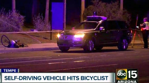 This March 19, 2018 still image taken from video provided by ABC-15, shows investigators at the scene of a fatal accident involving a self driving Uber car on the street in Tempe, Ariz. Police in the city of Tempe said that the vehicle was in autonomous mode with an operator behind the wheel when the woman walking outside of a crosswalk was hit.