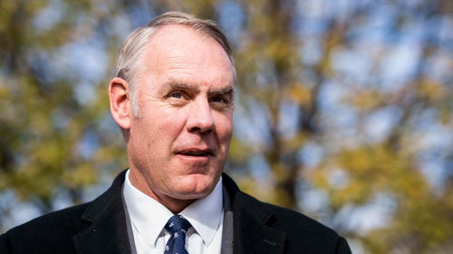 Ryan Zinke attends an event at the U.S. Marine Corps War Memorial announcing the newly carved engravings of Afghanistan and Iraq campaigns and the restoration project of the memorial, in Arlington, Virginia Tuesday November 21, 2017.