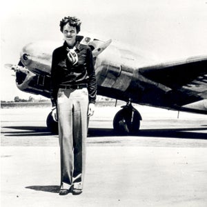 Amelia Earhart standing in front of the Lockheed Electra in which she disappeared in July 1937.