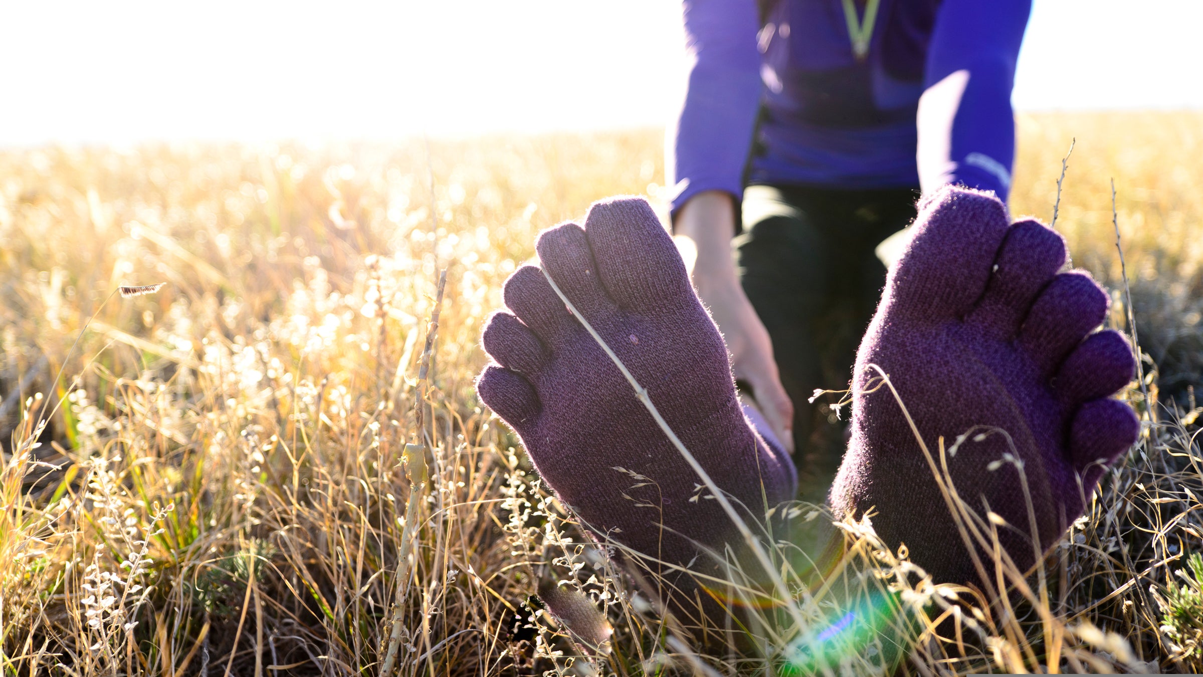 A woman runs at sunrise on the trails of Green Mountain near Denver, Colorado.