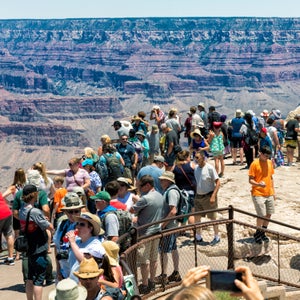 Tourists at viewpoint, South Rim, Grand Canyon National Park, Arizona, USA
