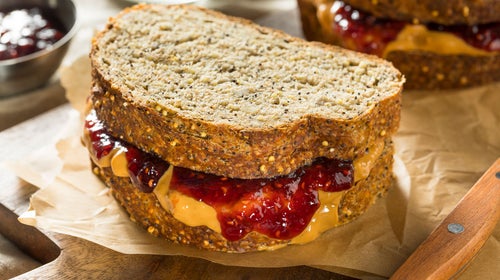 A classic peanut butter and jelly sandwich on wheat bread