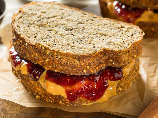 A classic peanut butter and jelly sandwich on wheat bread