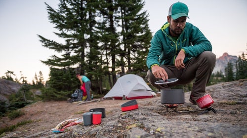 A backpacking stove that burns everything from kerosene to unleaded gasoline will take you around the world without hassle.