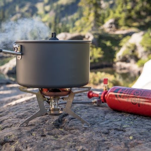 A backpacking stove that burns everything from kerosene to unleaded gasoline will take you around the world without hassle.