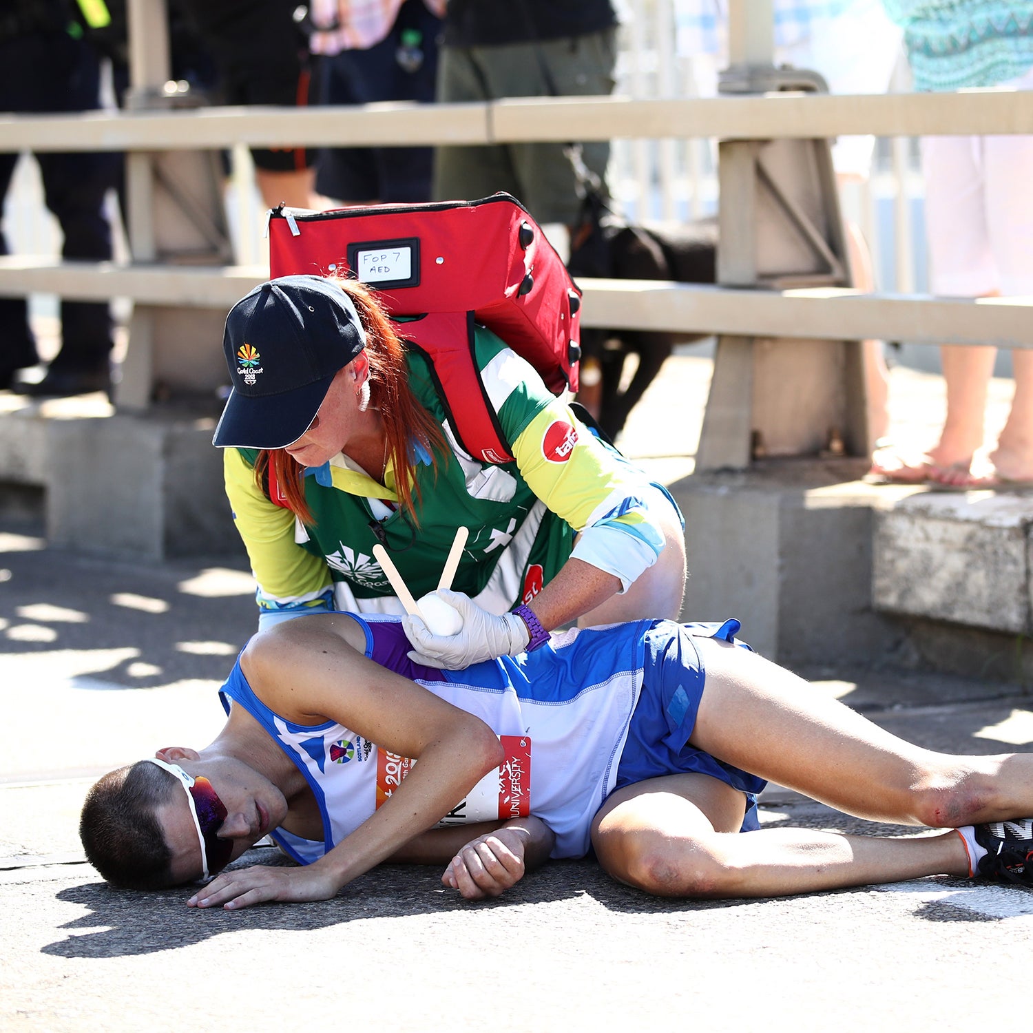 Callum Hawkins had a two-minute lead on the field, but he began weaving back and forth and collapsed twice before being taken from the course in an ambulance.