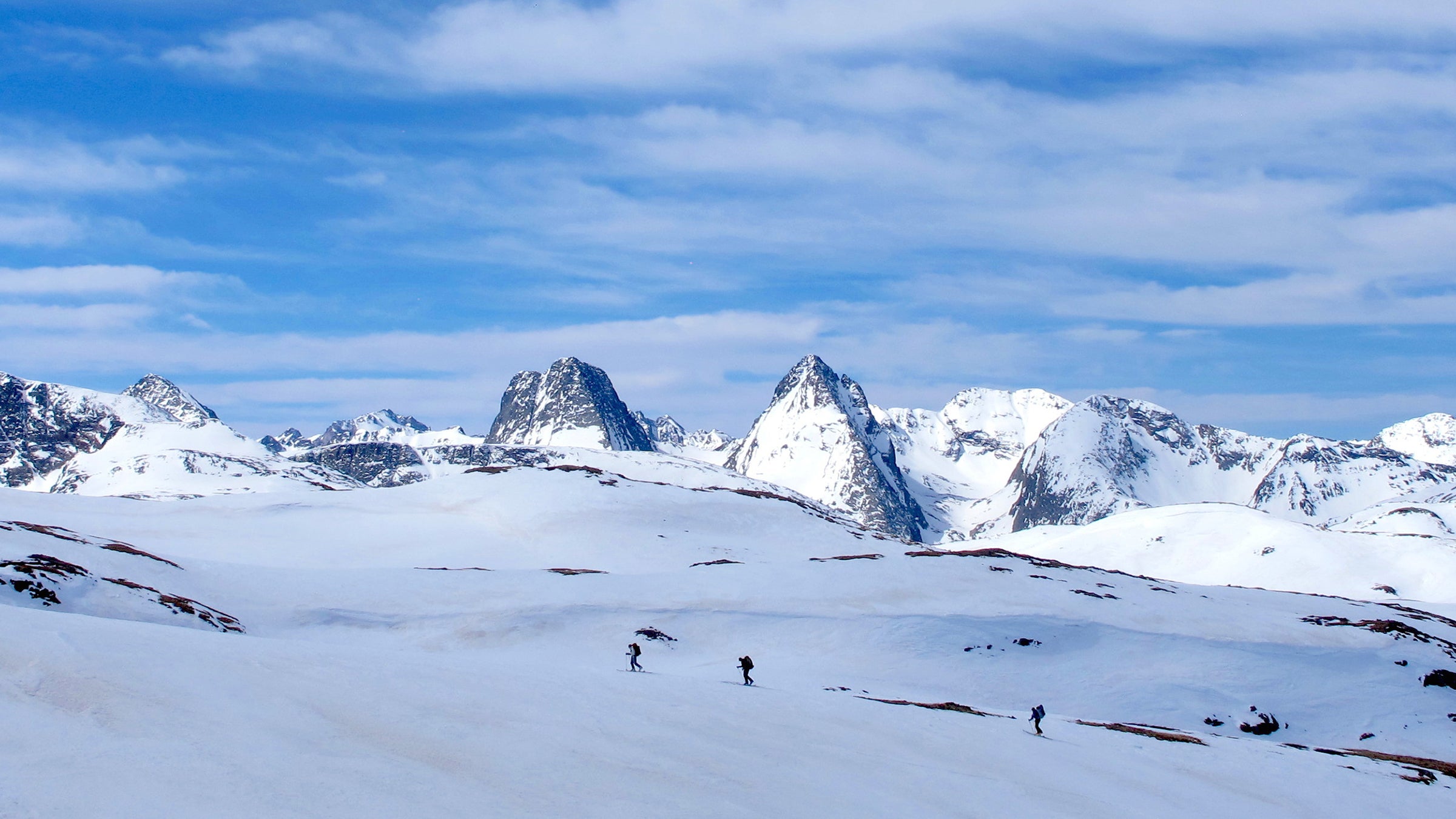 Denny Hogan, Matt Wells, and Tim Cron ski through the San Juan Range outside Silverton. 