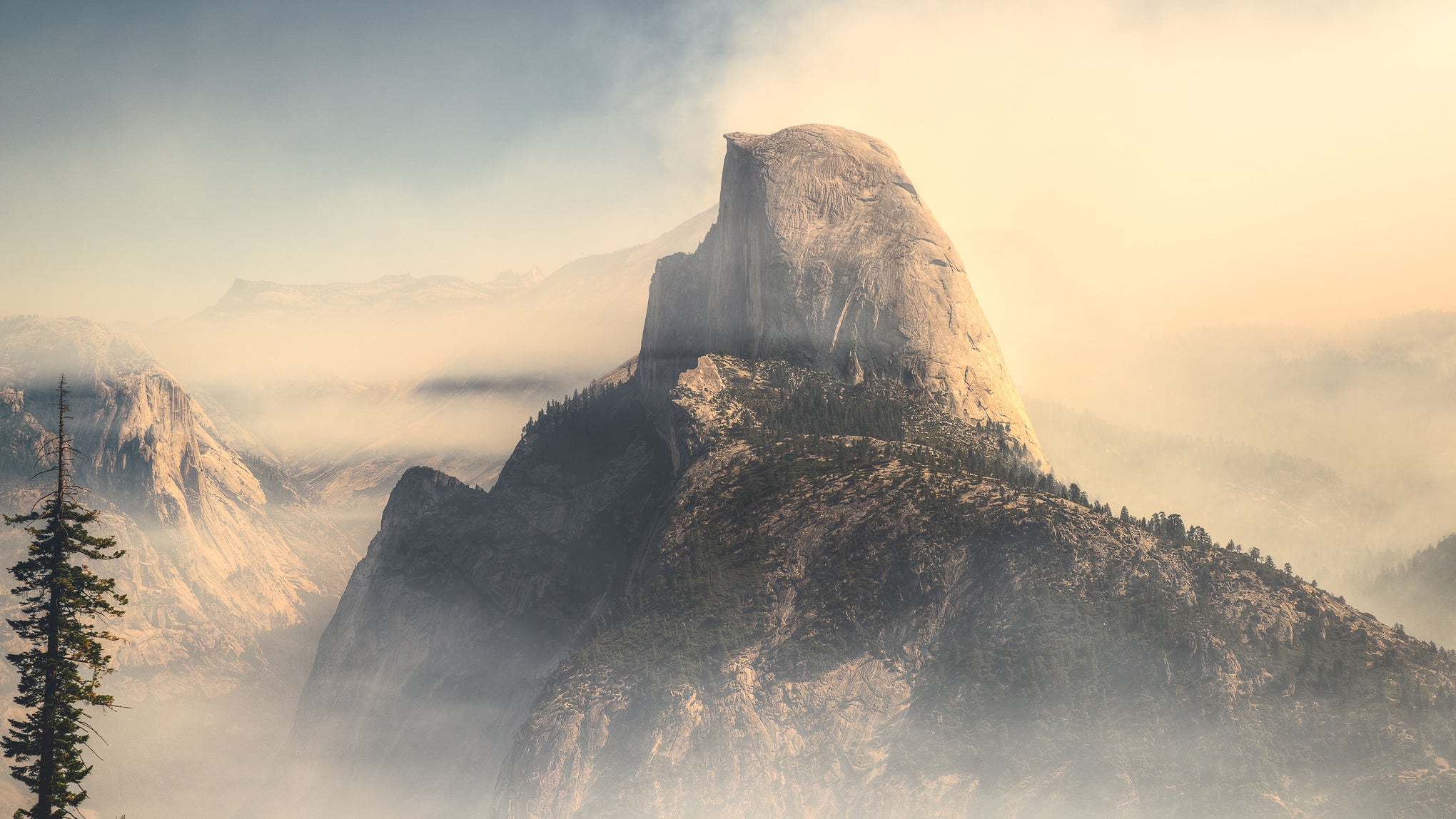 Yosemite's Half Dome, surrounded by smoke from 2014's El Portal fire. 