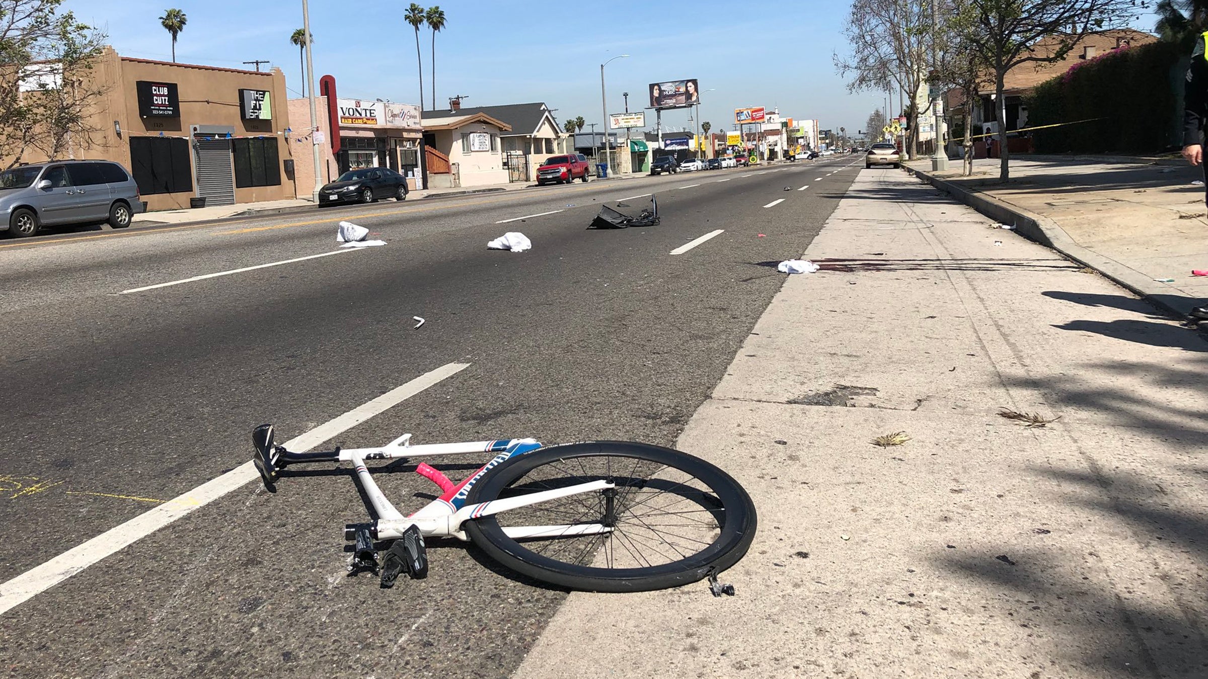 The security video didn't record the impact that killed Woon, but photos of the crime scene show the collision snapped his bike in half.