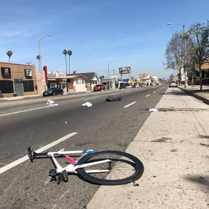 The security video didn't record the impact that killed Woon, but photos of the crime scene show the collision snapped his bike in half.