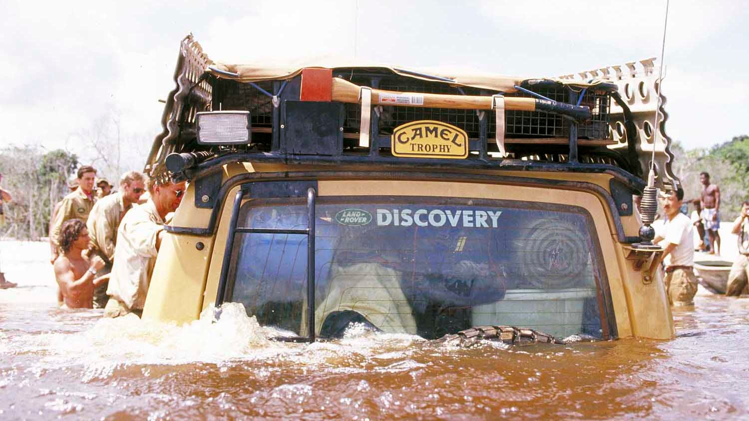 A Land Rover fords a river during the Camel Trophy. 