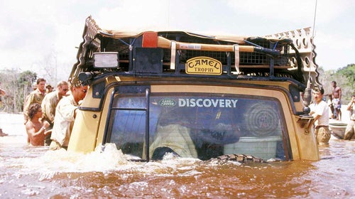 A Land Rover fords a river during the Camel Trophy.