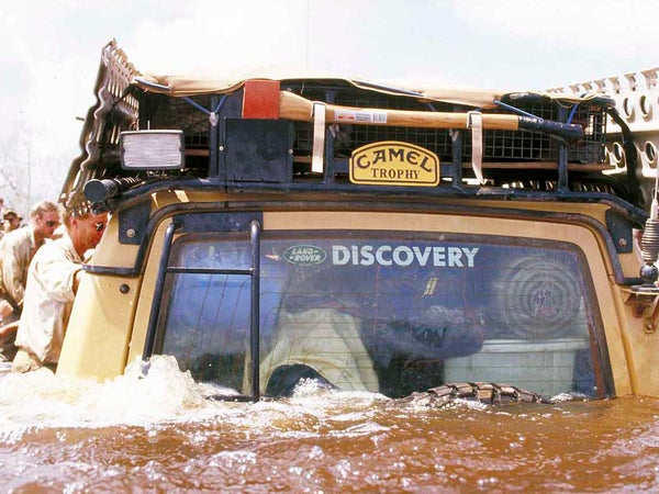 A Land Rover fords a river during the Camel Trophy.