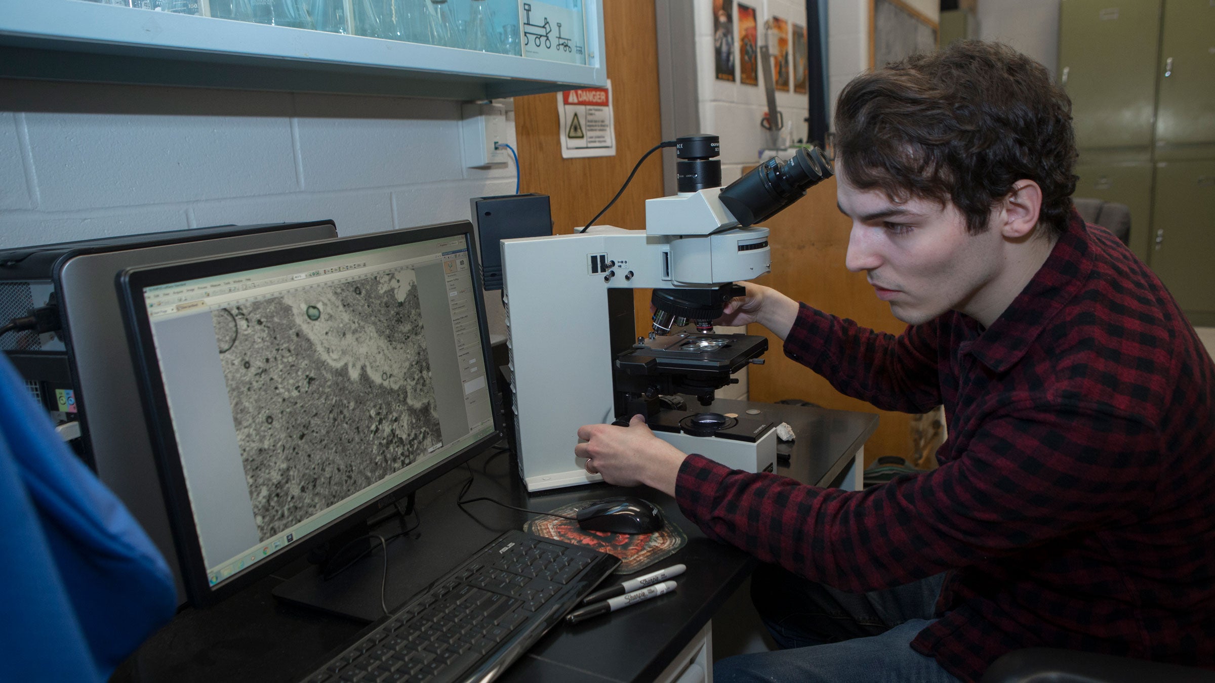Gangidine is studying microbial fossils to find biosignatures, elements that show evidence of past life because organisms consume or excrete them or otherwise interact with them.