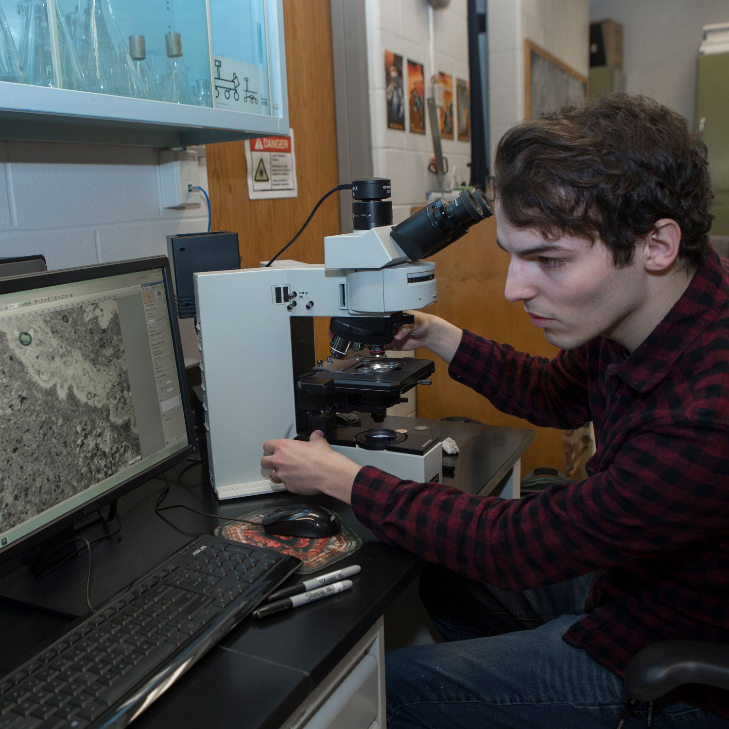 Gangidine is studying microbial fossils to find biosignatures, elements that show evidence of past life because organisms consume or excrete them or otherwise interact with them.