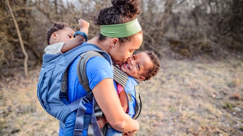 https://cdn.outsideonline.com/wp-content/uploads/2018/06/27/hiking-mom-kissing-baby_h.jpg?crop=25:14&width=500&enable=upscale