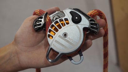 The Revo, open with a climbing rope threaded through the device.