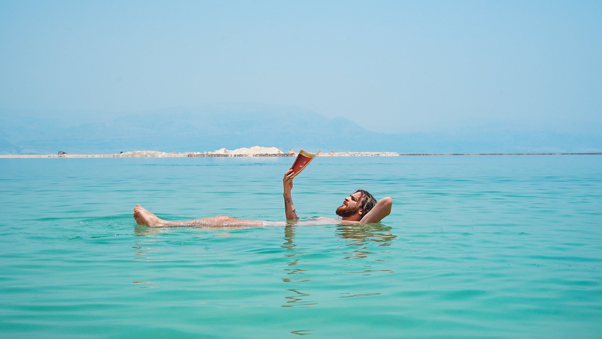 These reads will keep you riveted when it’s time to get out of the water.