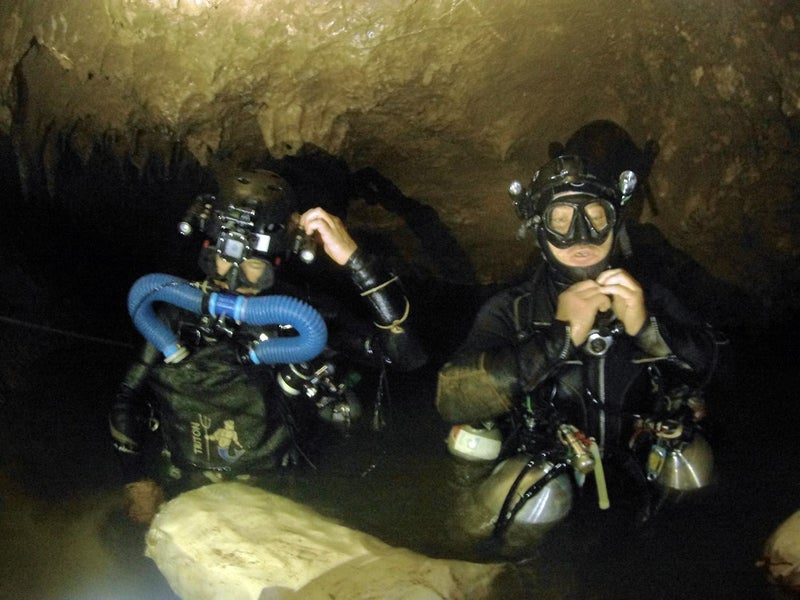 Divers preparing to descend in search of the soccer team's location.