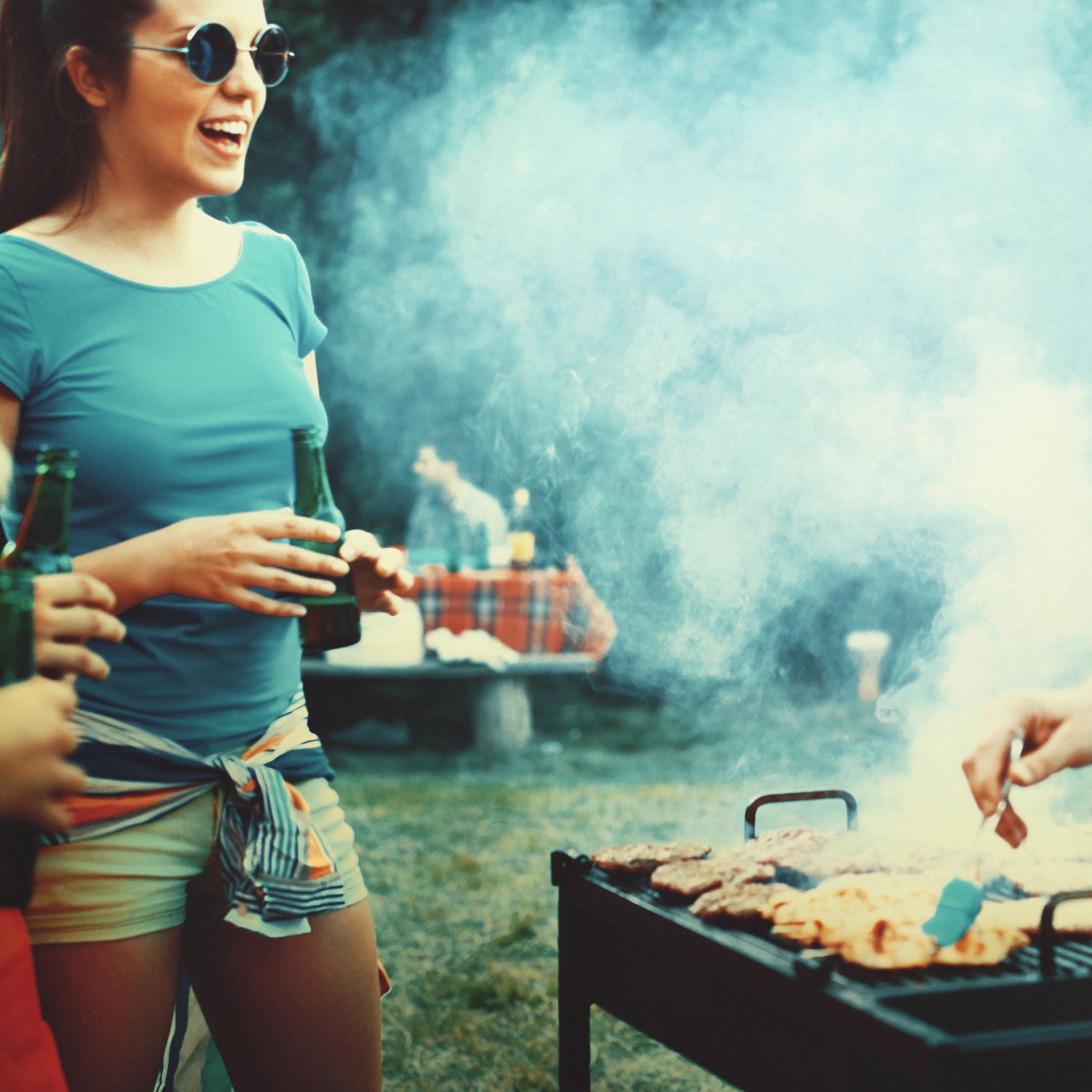 Friends grilling outside