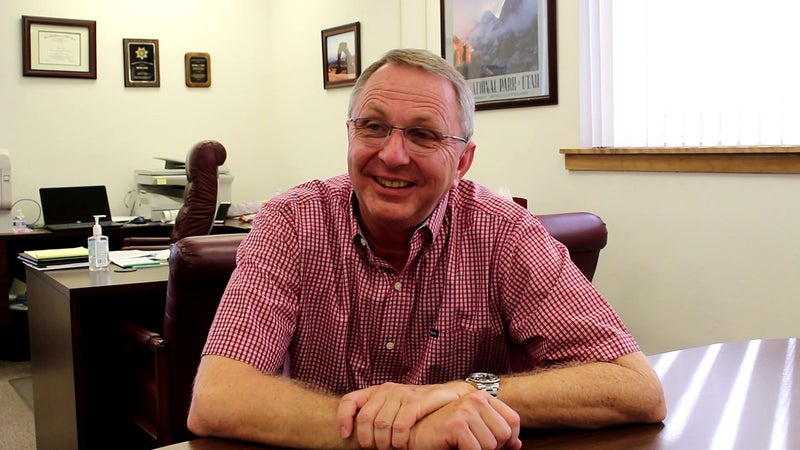 Dean Cox sitting at desk