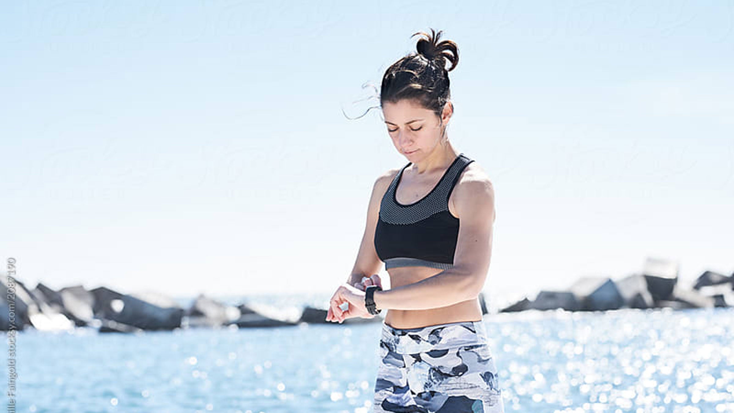 Woman working out checking watch