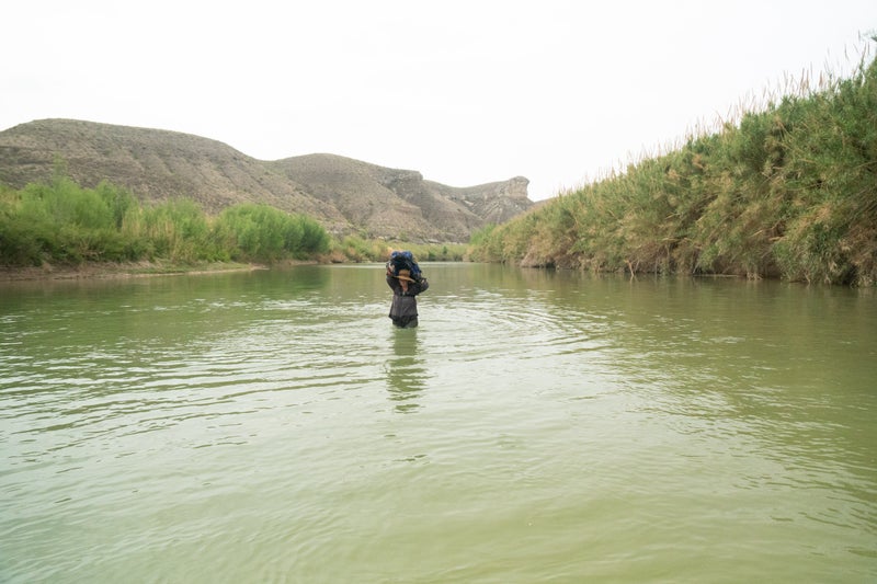 Four months into the six-month thru-hike, Wernstedt-Lynch wades in the Rio Grande, which marks the border between Mexico and the Texas.