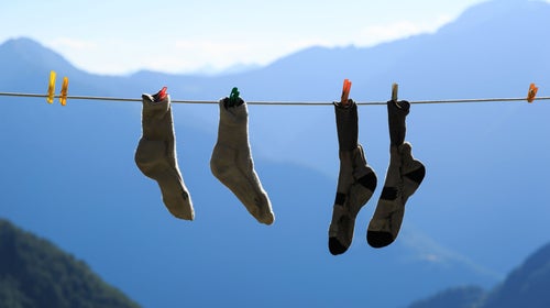 Socks drying on clothesline in mountains