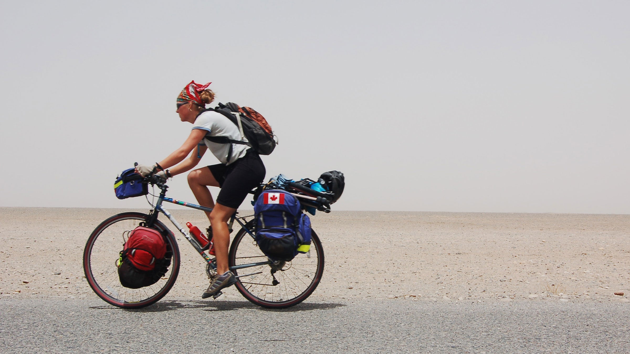 Kate Harris cycling through Tibet in 2006.